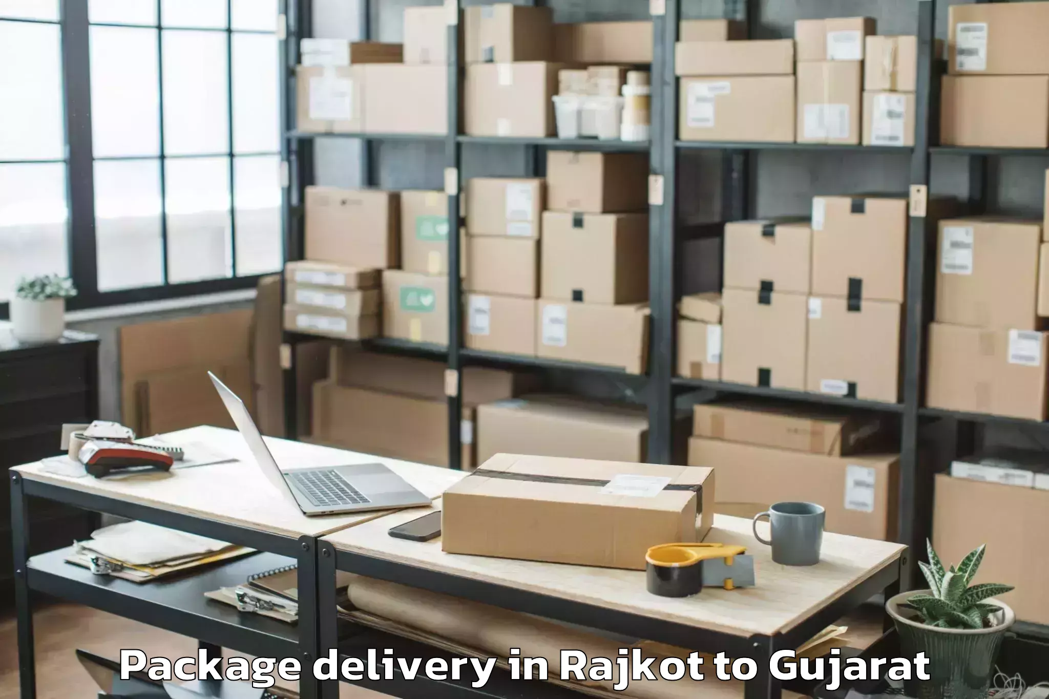 Top Rajkot to Abhilashi University Surat Package Delivery Available